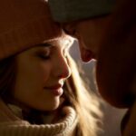 close up of happy couple in winter clothes