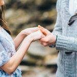 young couple in love on a mountain river