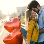 Portrait of loving couple dating at sunset in city