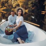 Love couple with fruit basket in boat