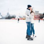 Love couple hugs on skate rink