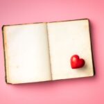 Love concept. Heart on open vintage book.