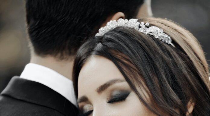 Naše mesto close up of smiling bride with her eyes closed hugging groom
