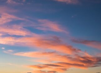 Do kraja vremena photo of person riding kayak during dawn