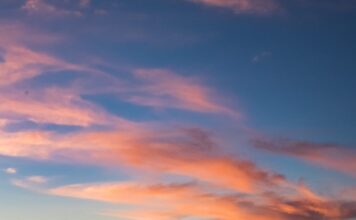 Do kraja vremena photo of person riding kayak during dawn