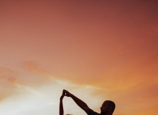Bečki valcer couple dancing on the pavement during sunset