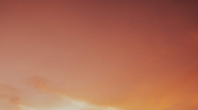 Bečki valcer couple dancing on the pavement during sunset