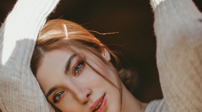 Kletva woman wearing gray v neck top